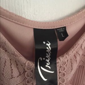 Cold shoulder lace dress knee length in soft pink.